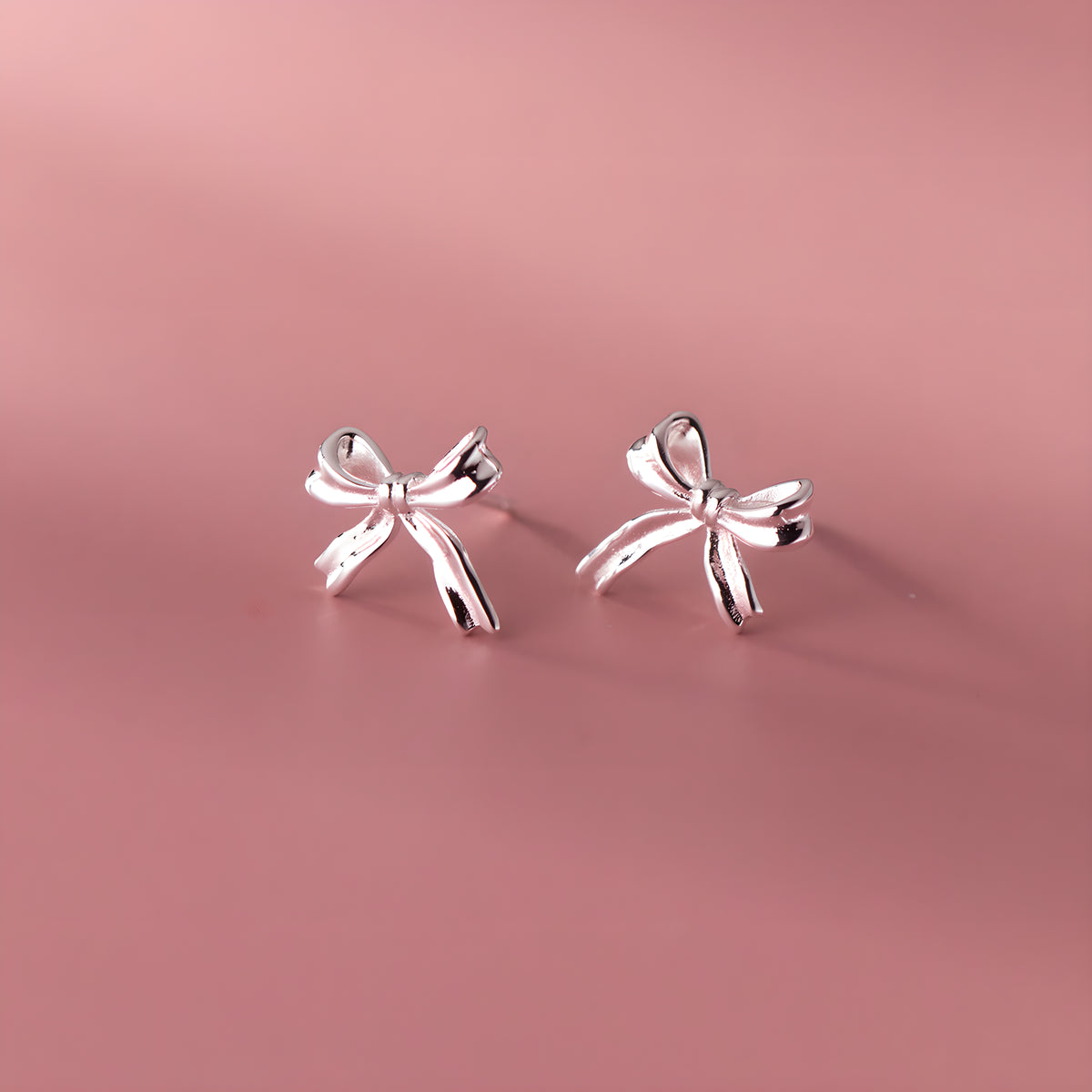 Silver Bow Stud Earrings - Delicate & Elegant Design